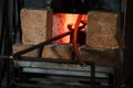 Blacksmith oven fire in workshop for metal heeting Royalty Free Stock Photo