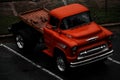 a large red truck parked next to another red truck in a parking lot Royalty Free Stock Photo