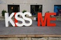 Large Red and white KISS-ME Lettering, Via dei Giustiniani, Genoa, Italy