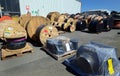 Large reels of pipe in a storage yard on refinery site