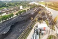 Large reserves of coal at a power plant many cranes unloading coal, a lot of coal, top view Royalty Free Stock Photo