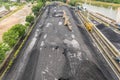 Large reserves of coal at a power plant, many cranes unloading coal, a lot of coal, top view Royalty Free Stock Photo