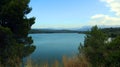 Large reservoir lake in the mountains, very blue water, pine trees on the shore, beautiful landscape, Beniarres, Spain Royalty Free Stock Photo