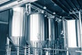 Craft brewery. Large reservoirs, tanks and pipes with manometers in private microbrewery.