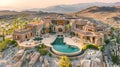 Large Residence in the Desert with a Pool and Surrounded by Mountains Royalty Free Stock Photo