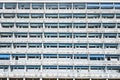 Large residential building, identical windows and balconies, block of flats, skyscraper, full frame Royalty Free Stock Photo