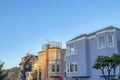 Large residential house buildings near the street lamps and stop sign in San Francisco, California Royalty Free Stock Photo