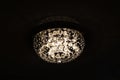 Large retro glass chandelier on ceiling in dark Royalty Free Stock Photo