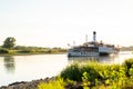 Large retro tourist steamer with a pipe sails along the calm Elbe river Royalty Free Stock Photo