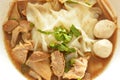 Large rice noodle with braised pork in herb brown soup