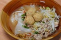 Large rice noodle topping shrimp ball in soup