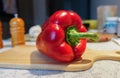 Large ripe Capsicum annuum or sweet red bell pepper on the white background close up. Vegetarian Concept. Organic vitamins Royalty Free Stock Photo