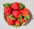 Large ripe red juicy strawberries in a bowl on a white background Royalty Free Stock Photo