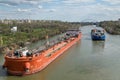Large river barges for transportation of oil products swim through the navigable Volga-don canal