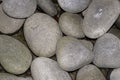 Large river rocks on wet pavement texture Royalty Free Stock Photo