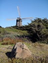 Large Rock in field and Golden Gate Park North Dutch Windmill Royalty Free Stock Photo