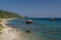 Large rock formations in a turquise rocky bay in Kefalonia