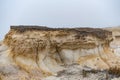 Large rock prominently featured in a desolate beach landscape Royalty Free Stock Photo