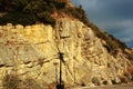 Green trees, nature of the Crimea,a large rock and a street lamp, a quay and a stone coast, rocks on the seashore, a tall black p Royalty Free Stock Photo