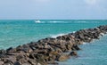 Large rock walkway at Miami Beach, boating