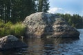 large rocks water lake forest the stones sunlight Royalty Free Stock Photo