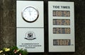 Clock and LED tide times information on Royal Yacht Squadron wall. Isle of Wight England