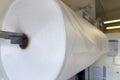 Large roll of industrial packaging film. Soft bubble film for packaging during transportation at the enterprise