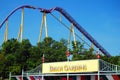 A large roller coaster looms over the entrance