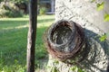 Large rolls of iron wire hanging on the wall of a rustic constructi