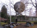 Large round antenna for receiving signals military communications tower secret satellite transmitter orbital station in the forest Royalty Free Stock Photo