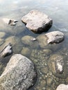 Large round beautiful natural stones cobblestones in water, sea, lake, river. Background, texture Royalty Free Stock Photo