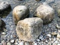 Large round beautiful natural stones cobblestones in water, sea, lake, river. Background, texture Royalty Free Stock Photo