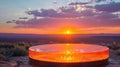 A large, round glass structure is illuminated by the setting sun Royalty Free Stock Photo