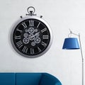 A large round indoor clock on the wall. Big clock on metal rack Royalty Free Stock Photo