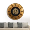 A large round indoor clock on the wall. Big clock on metal rack Royalty Free Stock Photo