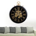 A large round indoor clock on the wall. Big clock on metal rack Royalty Free Stock Photo