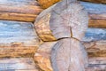 Large round log wooden background folded wall house rustic background base base close-up light beige pattern