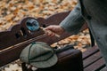 Large round magnifier on long handle in detective hand