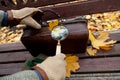 Large round magnifier on long handle in hand of naturalist