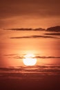 large round orange sunrise or sunset with texture of cloudy sky for background Royalty Free Stock Photo