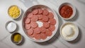 Large round white plate filled with slices of sausage