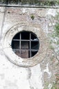 Large round window in an old abandoned building