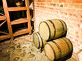 Large round wooden barrels for beer, wine in the old cellar of the Middle Ages made of brick Royalty Free Stock Photo