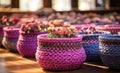 a large row of colorful baskets of flowers sitting on a table Royalty Free Stock Photo