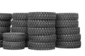 Large rubber tires for trucks lying on the street. Black tires close-up with large tread Royalty Free Stock Photo