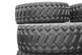 Large rubber tires for trucks lying on the street. Black tires close up with a large tread lie on top of each other Royalty Free Stock Photo