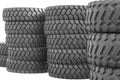 Large rubber tires for trucks lying on the street. Many close-up tires with a large tread are lying on the ground Royalty Free Stock Photo