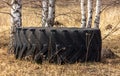 A large rubber wheel lies like rubbish