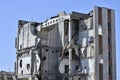 A large ruined building with the remains of the communication against the blue sky. Background