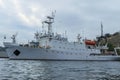 A large Russian ship of the Black Sea Fleet in the port of Sevastopol against the background of the gray sky. Russian Royalty Free Stock Photo